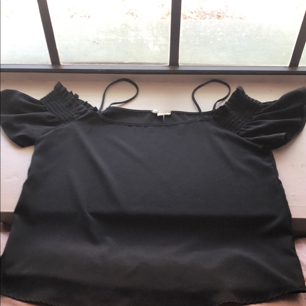 Elegant Black Women's off the shoulder blouse.
